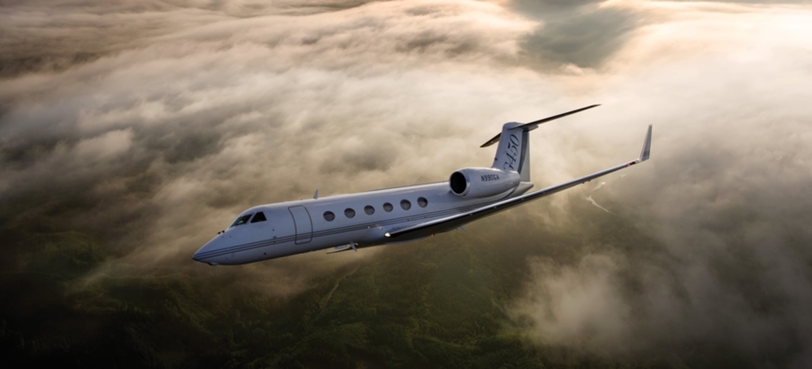 Gulfstream G450 mid air with sun in background