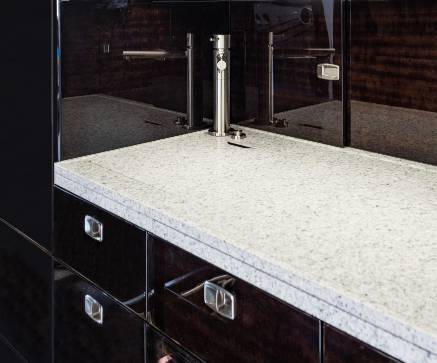 Embraer Legacy 500 refurbished galley area with granite counter